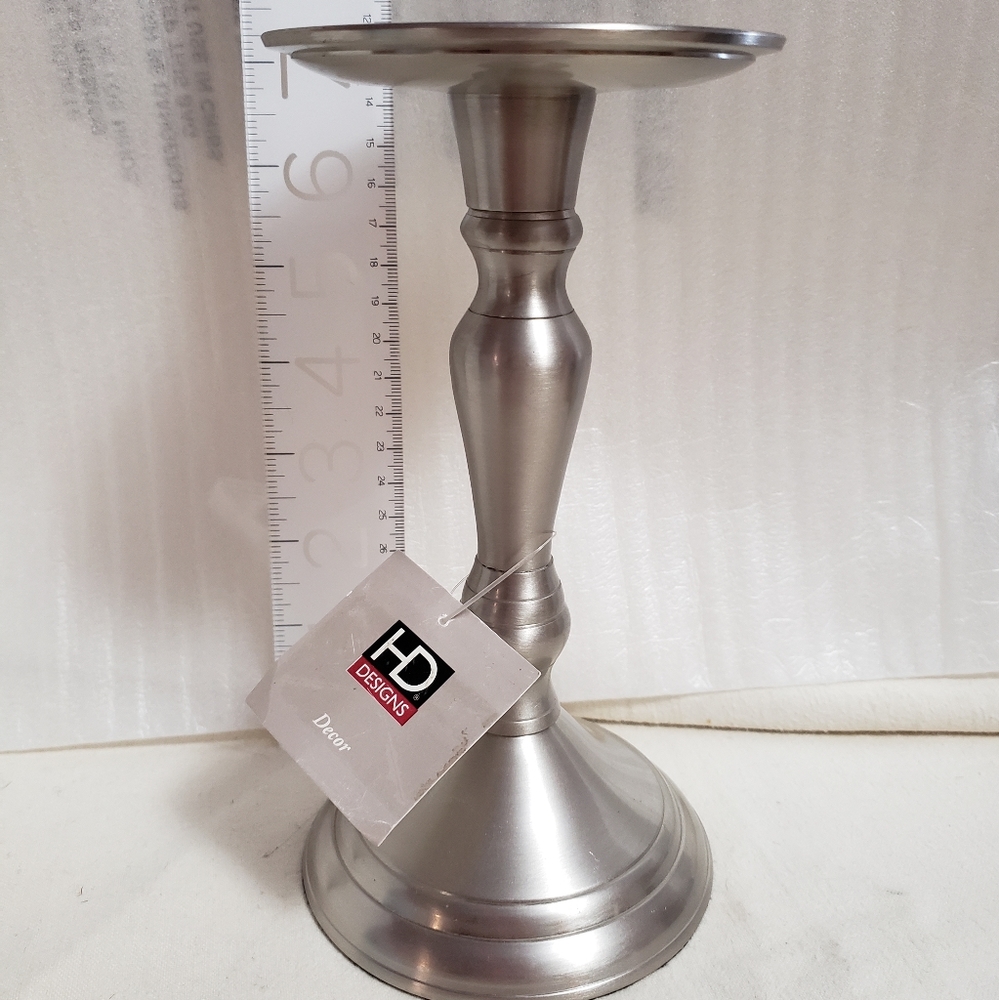 Silvertone candle holder. One 7 inch tall.